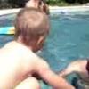 View the image: Playing in the pool at the Grandparent's